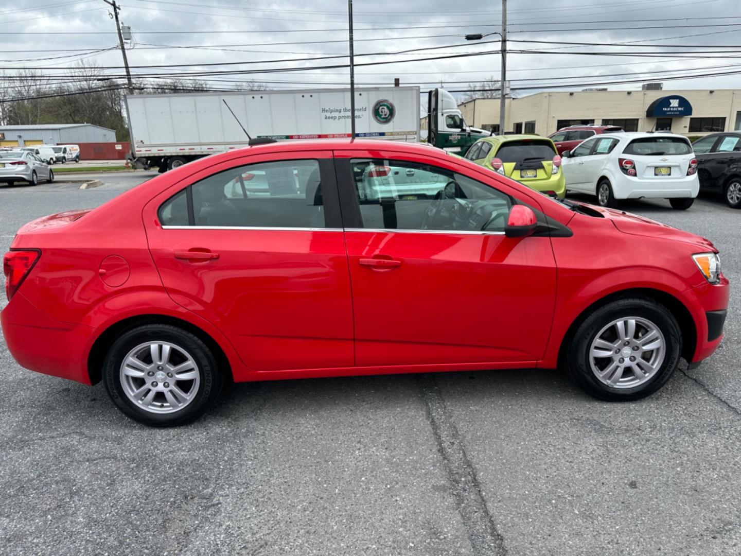 2015 RED Chevrolet Sonic LT Auto Sedan (1G1JC5SH6F4) with an 1.8L L4 DOHC 24V engine, 6-Speed Automatic transmission, located at 1254 Manheim Pike, Lancaster, PA, 17601, (717) 393-9133, 40.062870, -76.323273 - Photo#3